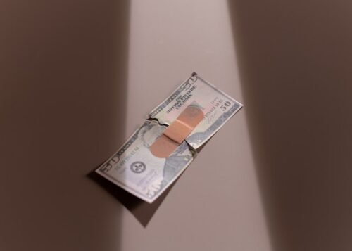 bill with bandaid