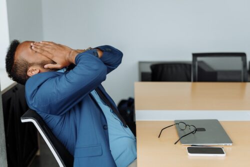 frustrated man with hands over face